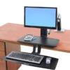 uspended keyboard tray of the WorkFit-A desk, positioned below desktop level for optimum computing comfort.