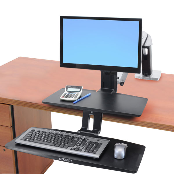 uspended keyboard tray of the WorkFit-A desk, positioned below desktop level for optimum computing comfort.