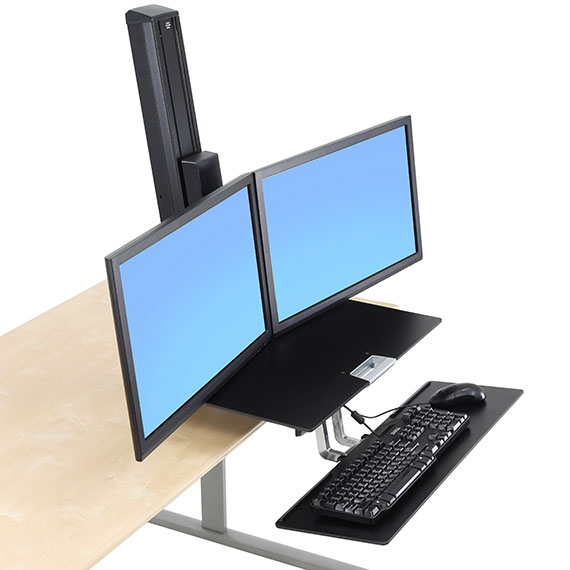 Side view of the WorkFit-S device with dual monitor mounts, keyboard tray, and adjustable height mechanism.
