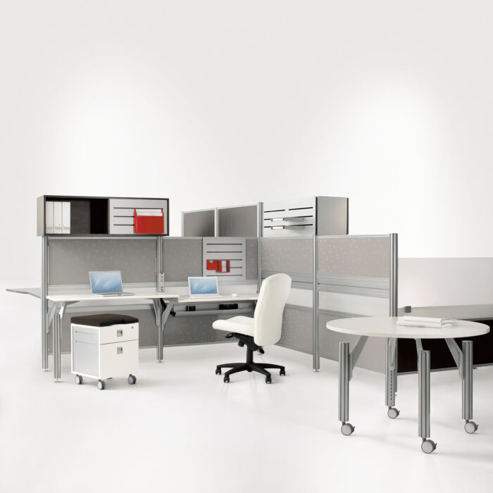 TAYCO Up workstation with height-adjustable worksurface and beam mounted screens for visual privacy and natural light transmission.