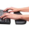 The Kensington ErgoSoft™ Wrist Rest for Slim Keyboards placed beside a slim keyboard on a desk.